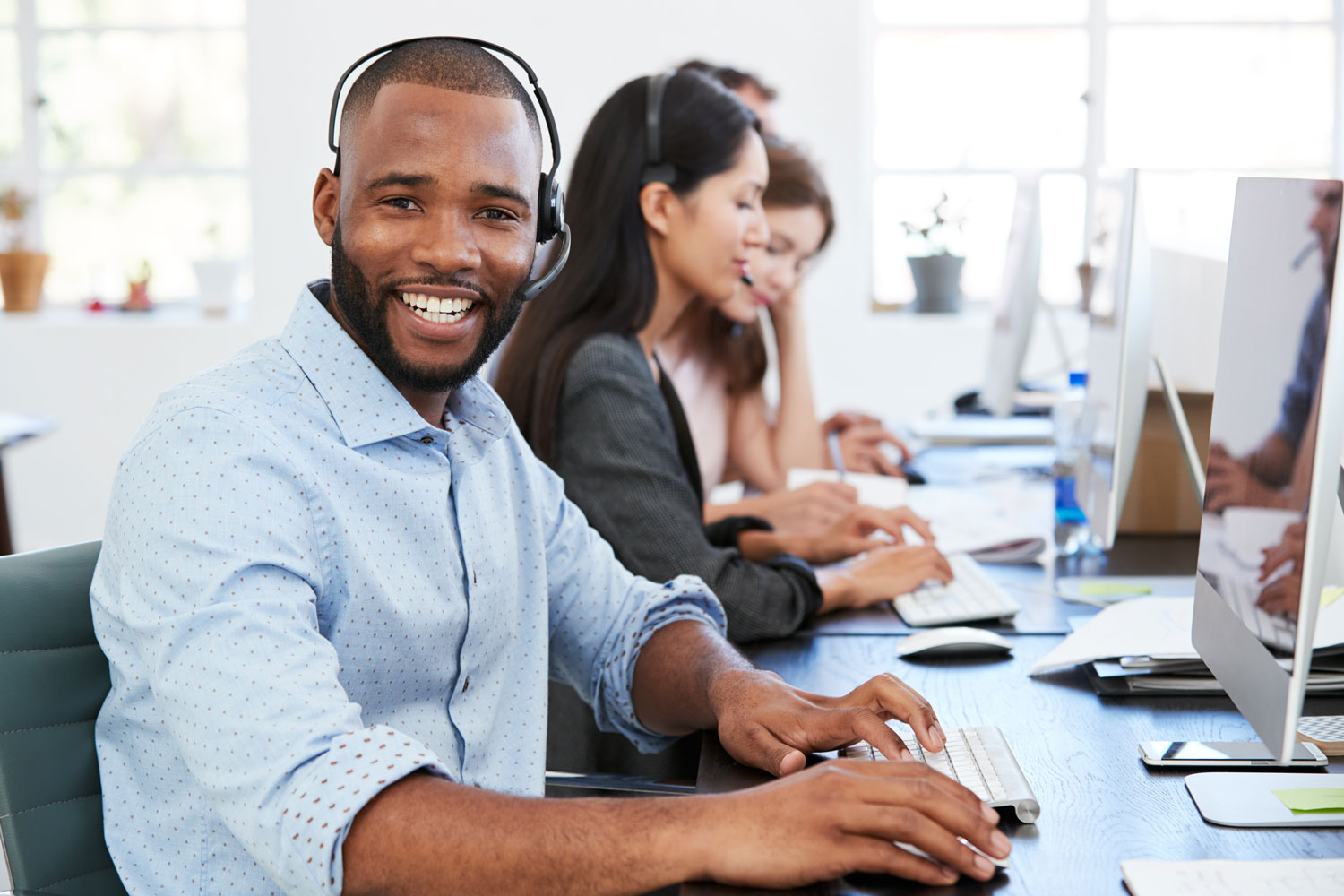 Young Customer Service Rep in Call Center